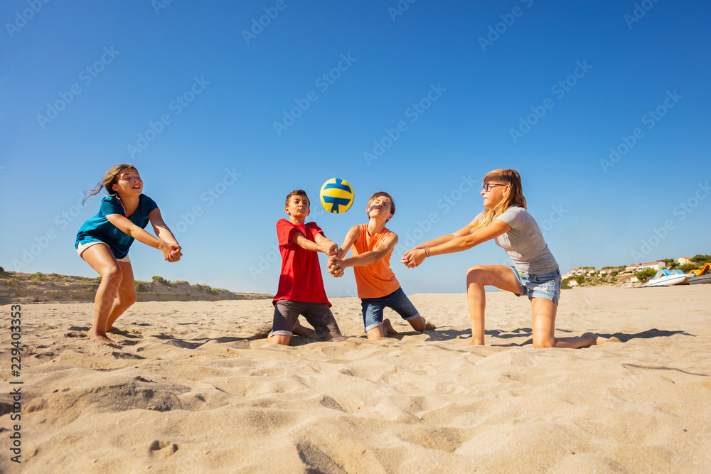 Happy beach volleyball players making forearm pass