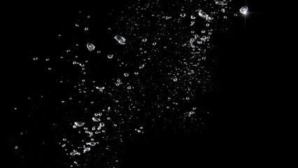Blurred images of close-up soda water bubbles fizzing up or splashing or sparkling like a exploding of a bomb on black background for represent refreshing from carbonated drinks menu.