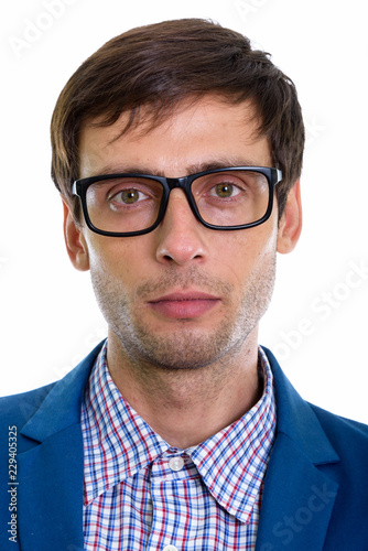 Face of young handsome businessman wearing eyeglasses © Ranta Images