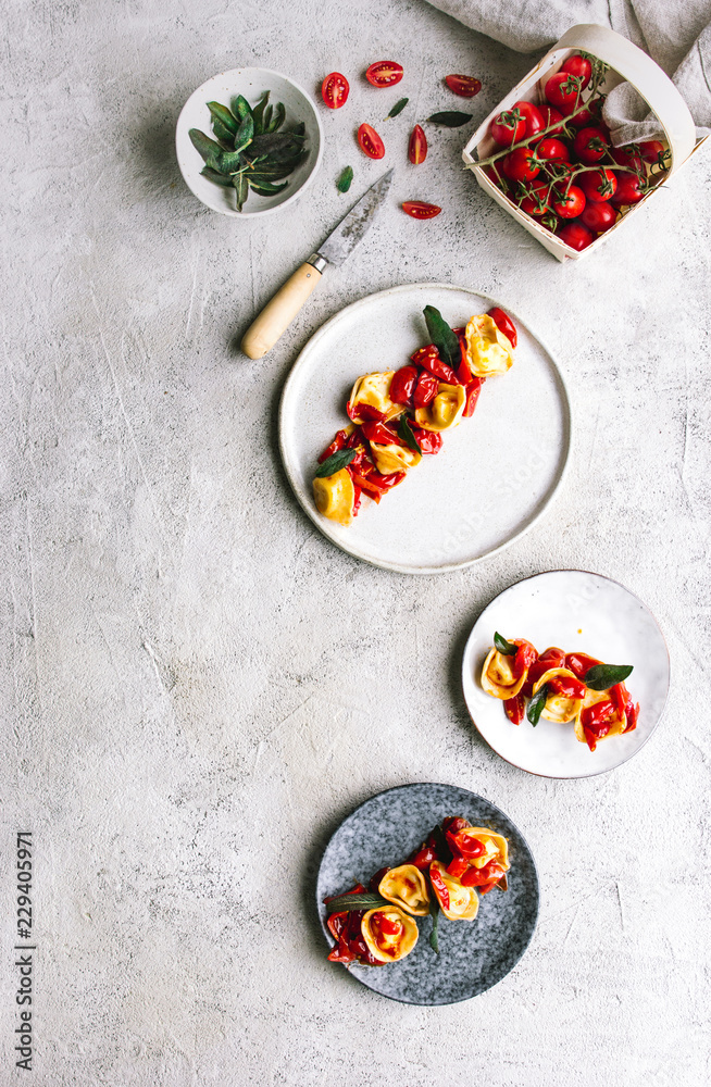 Top view of served tortellini with tomatoes Top view of served tortellini with tomatoes