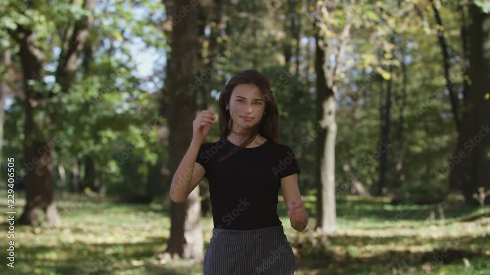Happy woman having fun outdoors, slow motion Happy woman having fun outdoors, slow motion