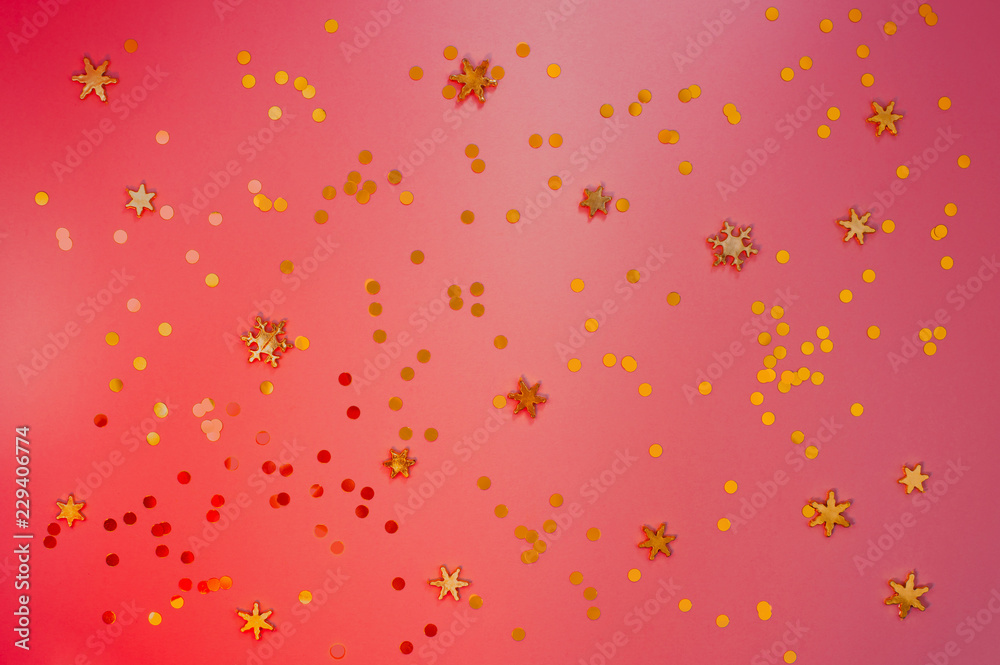 Festive coral background with golden confetti and snow flakes