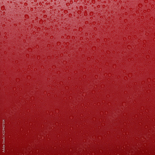 Drops of water on a red tile.  Beautiful pattern for texture background.