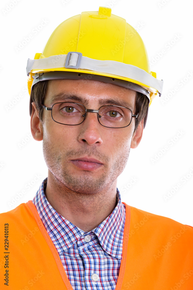 Face of young handsome man construction worker wearing eyeglasse Face of young handsome man construction worker wearing eyeglasse