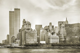 New York City skyline from NJ with World Trade Center featured as landmark of Twin Towers, destroyed in September 11, 2001. Sepia background, vintage style. Lower Manhattan in NYC, United States.