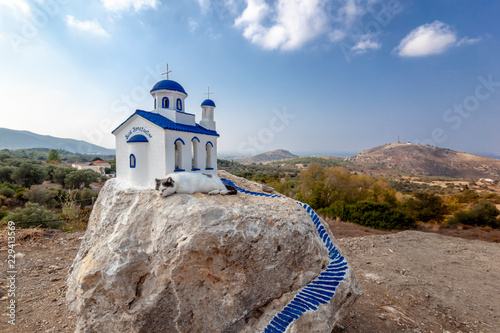 Kos island Zia village, The cat sleeps on a miniature version of an Orthodox church.