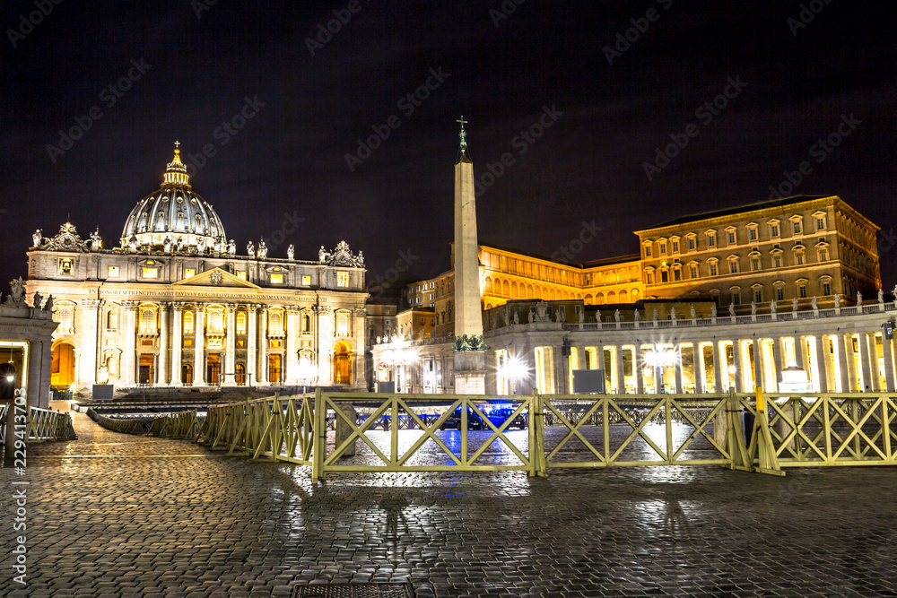 Rome, Italy - June 18, 2016: Skyline of the Basilica di San Pietro illuminated at night, Vatican City in Rome, Italy.