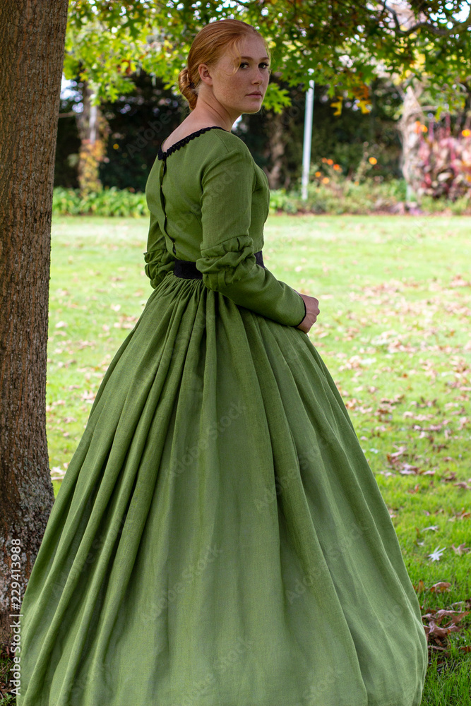 Victorian woman in green dress Stock Photo | Adobe Stock