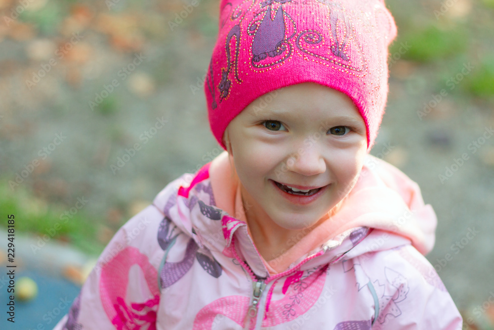 Autumn portrait of girl wearing hat and rain jacket Autumn portrait of girl wearing hat and rain jacket