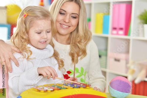 Portrait of a mother with little daughter