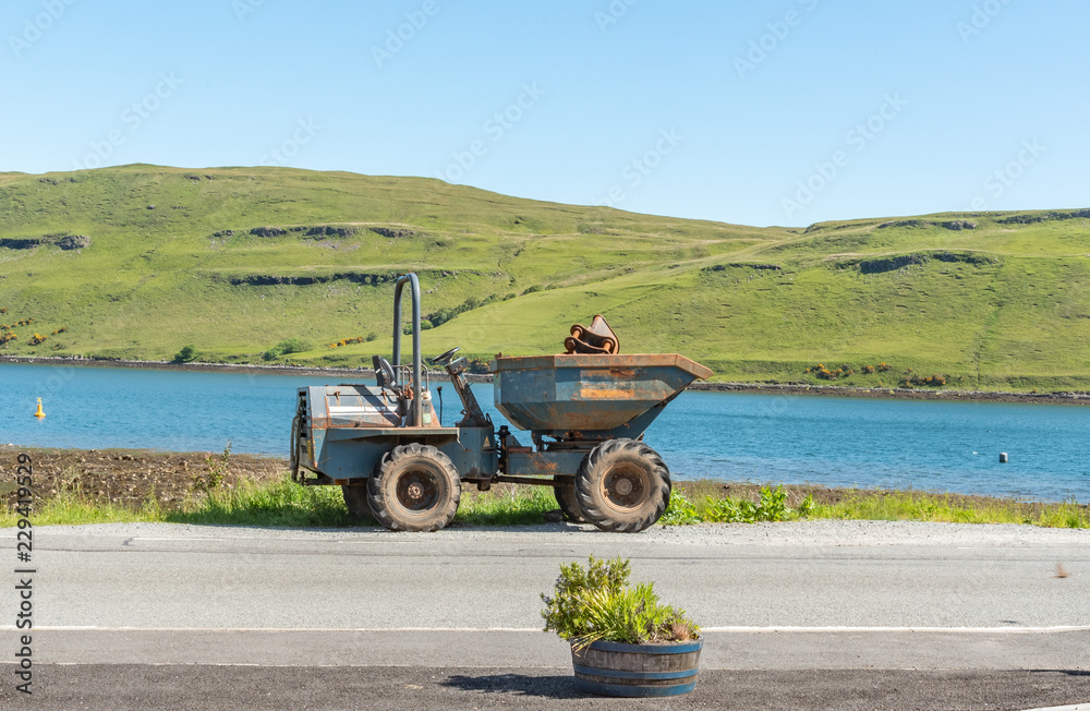 old tractor and lake