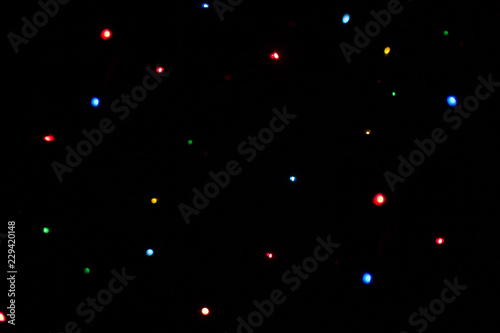 multicolored lights blurred bokeh on dark background