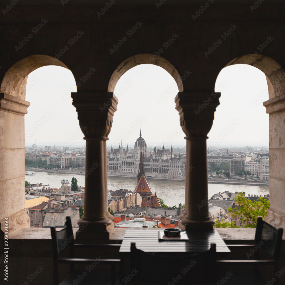 View of the Parliament in Budapest, through archways of Fisherman's Bastion, Hungary