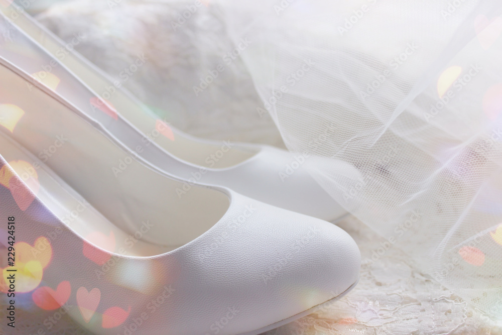 The background of the wedding day. White on white. White shoes. wedding shoes. Bride`s high heels. The fees of the bride. Wedding jewelry. The background of the wedding day. White on white. White shoes. wedding shoes. Bride`s high heels. The fees of the bride. Wedding jewelry.