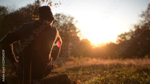 Outdoor Activities. Caucasian Men in His 30s Taking a Moment to Enjoy Scenic Sunset While Jogging in a Forest.