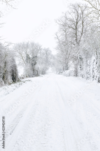 Country road covered in snow in winter © Paul Maguire