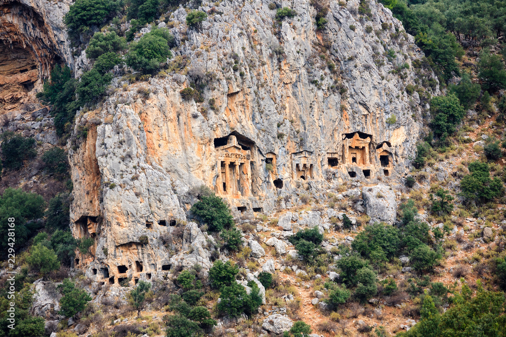 Ancient lycian Myra rock tomb ruins in Demre, Antalya.