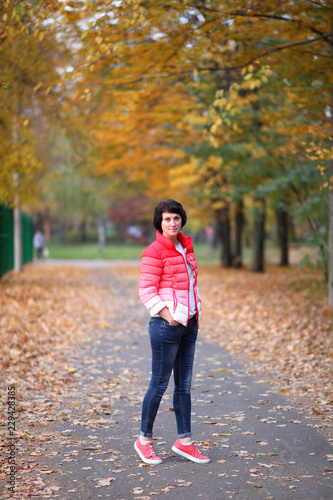 Girl in a yellow autumn park. © Master Video