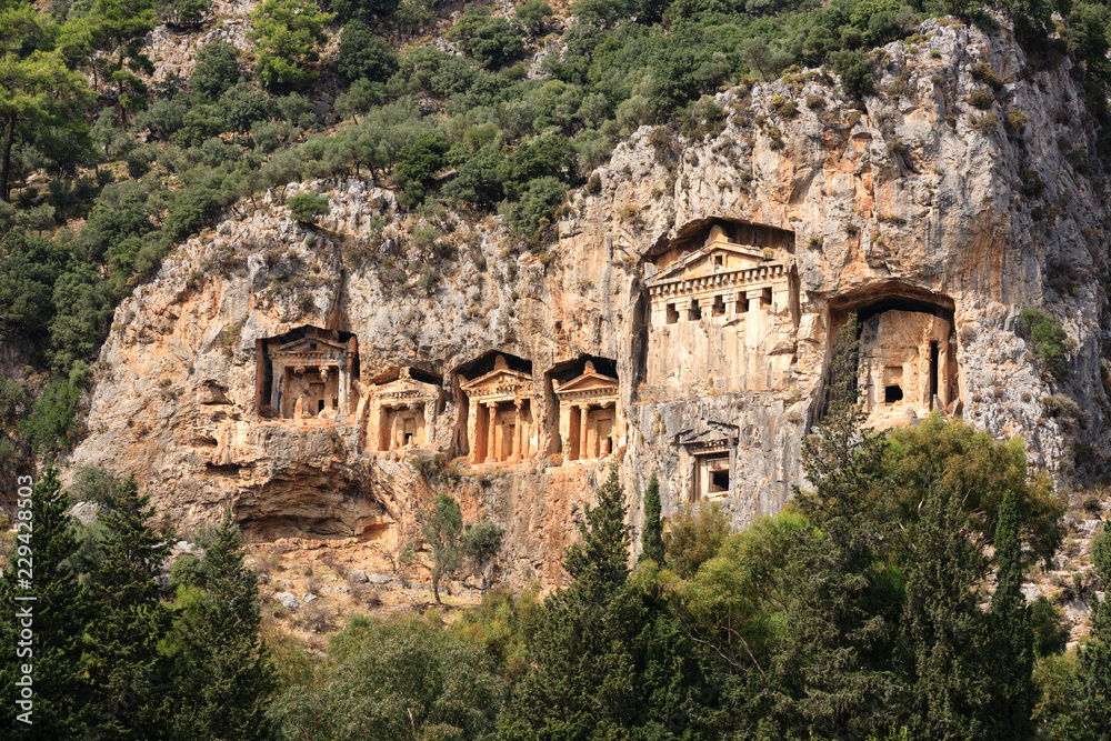 Ancient lycian Myra rock tomb ruins in Demre, Antalya.