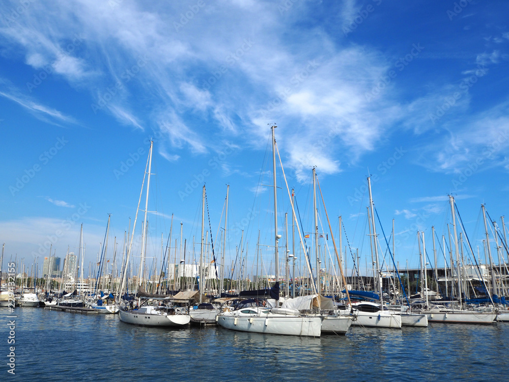 Port Vell in Barcelona, old harbor of Barcelona with an area of sports boats, yachts and a shopping area in Catalonia, Spain