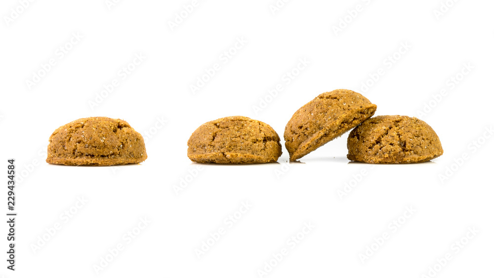 Pepernoten bunch of traditional cookies in a row on white background Pepernoten bunch of traditional cookies in a row on white background