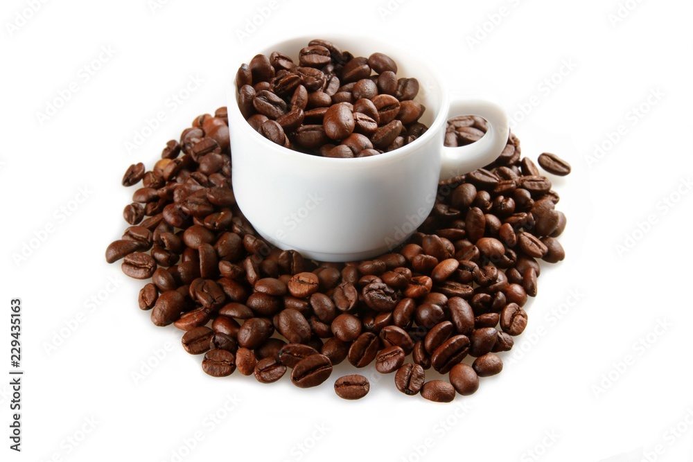 Mug full of, and surrounded by, coffee beans Mug full of, and surrounded by, coffee beans