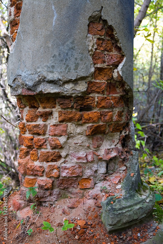 Fragment of a collapsing old column. photo