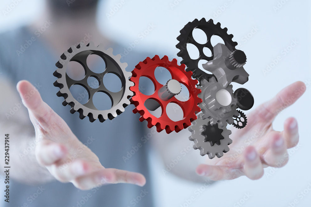 cogwheel in hand cogwheel in hand