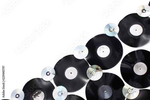 Vinyls and cd are screwed on white background isolated