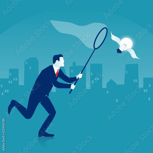 Businessman is trying to catch a flying light bulb with a scoop-net.