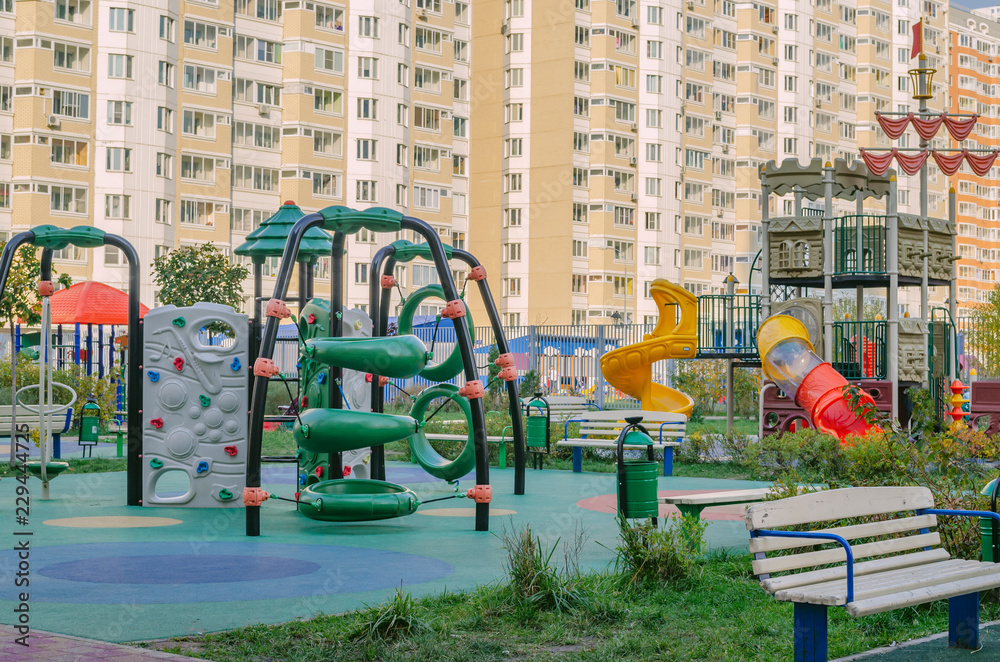 Children's Playground in a residential area on the background of multi-storey buildings