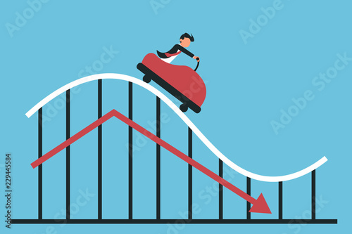 Man riding decreasing chart on blue