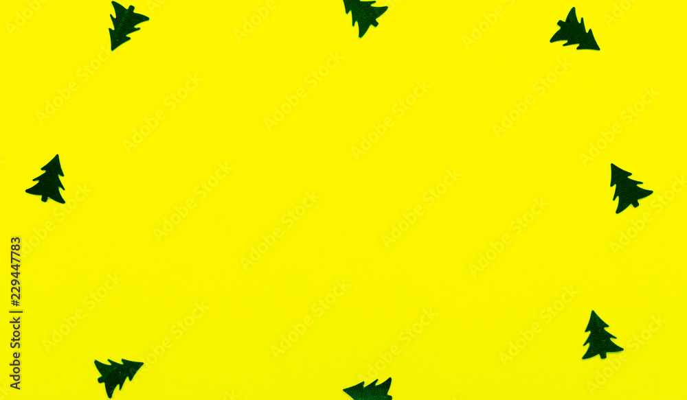 Background Christmas decoration-christmas trees,stars on a yellow background and copy space. Background Christmas decoration-christmas trees,stars on a yellow background and copy space.
