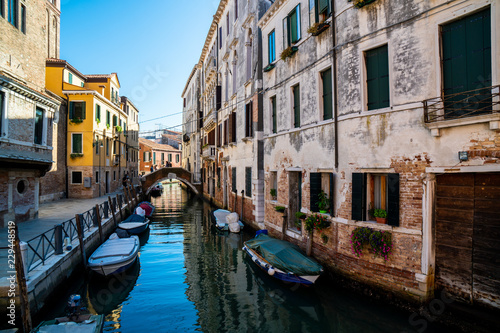 A venetian canal with medieval buildings and gondolas