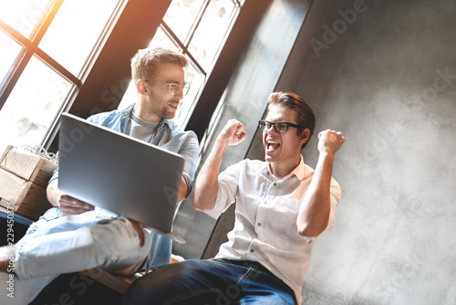 Two business colleagues sitting at a table, having a meeting.