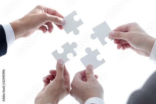 businessman people assembling jigsaw puzzle, team support and he