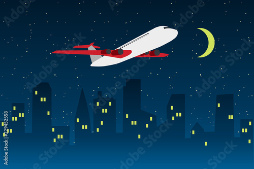 Plane flying above night city