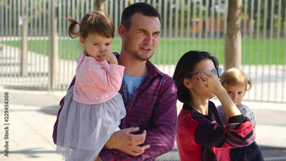 family walks in the park