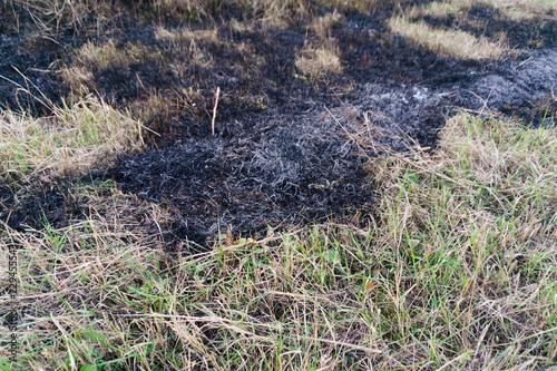Dry burnt grass on the field  air pollution