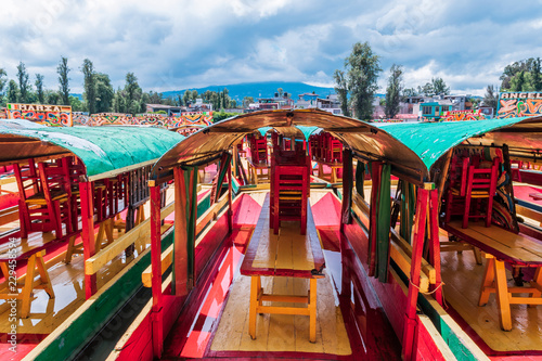 Mexican colorful trajineras on Xochimilco's lake.