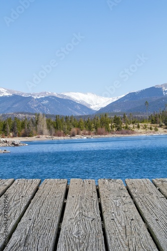 EMPTY WOOD DECK WITH BACKGROUND OF LAKE DILLON IN COLORADO (FOR PRODUCT DISPLAY MONTAGE)