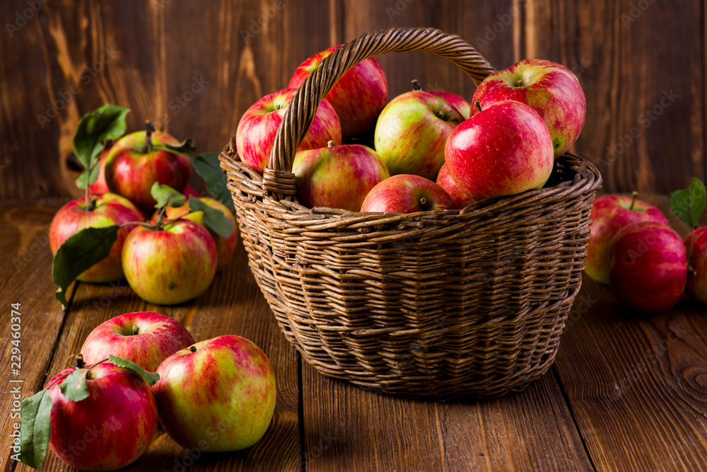 ripe red apples in a basket on the table ripe red apples in a basket on the table