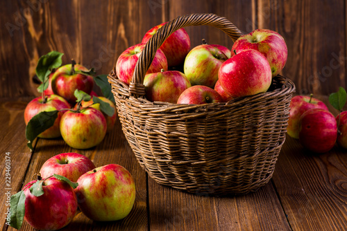 ripe red apples in a basket on the table