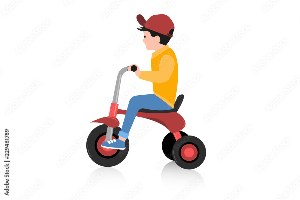 Boy riding tricycle on white