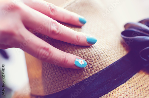 Woman with hand on hat conceptual lifestyle photography