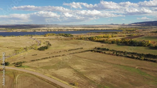 A pan along an open valley south of Denver.  Chatfield Reservoir is captured on the horizon photo