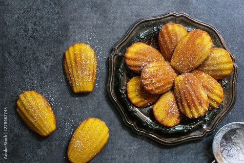 Classic Homemade Madeleines - French sponge cake baked in shell shaped mold photo