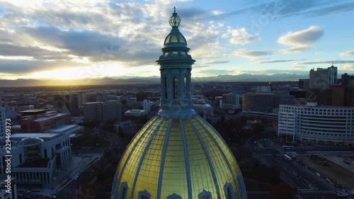 4k aerial drone footage.  Golden dome of Colorado State Capital at sunset.  City of Denver