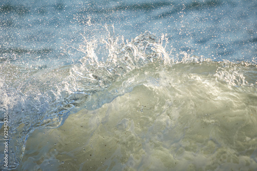 Fototapeta Naklejka Na Ścianę i Meble -  Big wave with sea foam and blue water. Splashing Waves. Summer background.
