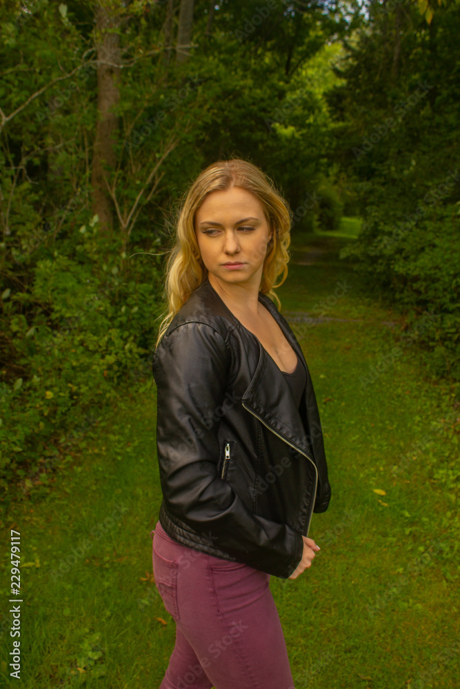 Fall woman in jacket in park